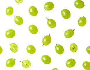 Green grapes scattered on black