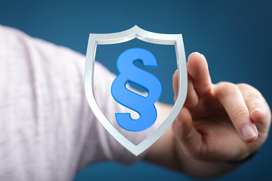 Conceptual image showing a shield with a paragraph symbol, symbolizing legal protection, law, and rights. Ideal for law firms, legal services, a