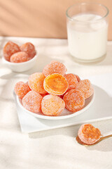 Sugar Coated Dried Orange Fruit Candies with Milk Glass Healthy Sweet Snack Food Photography