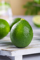 Fresh Green Limes on Wooden Surface - Citrus Fruit Photography