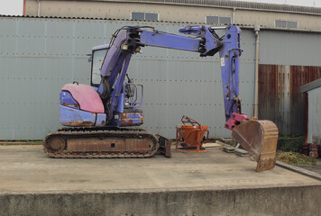 Compact heavy machine prepared at the construction site.