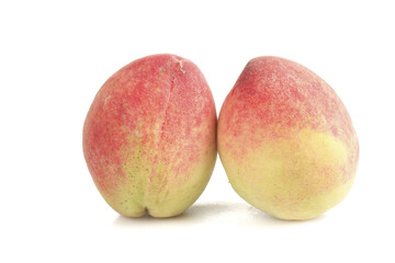 Two Fresh Ripe Peaches with Fuzzy Skin Isolated on White Background