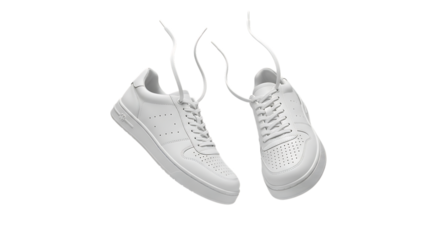 Stylish white sneakers floating in air isolated against black background