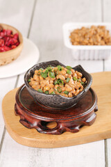 Japanese Natto Fermented Soybeans with Green Onions in Traditional Ceramic Bowl
