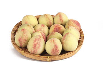 Fresh Peach First Crop Picked in Woven Bamboo Basket on White Background