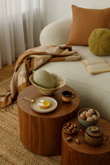 Close-up of cozy interior details – tea set, dessert and natural textures on a wooden table....