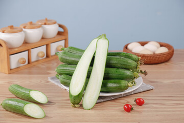 Fresh Homegrown Loofah Vegetables from Shouguang Farmers Market Display on Wooden Kitchen Table