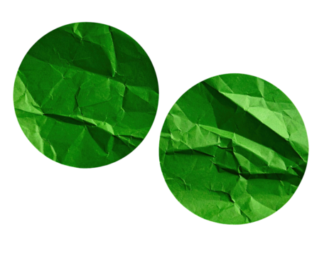Two circular pieces of crumpled green paper