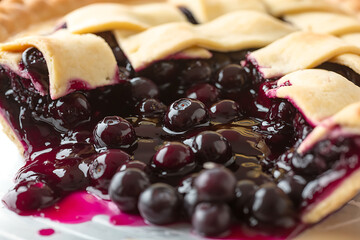 A freshly baked blueberry pie with a lattice crust, showcasing a sweet, juicy filling.