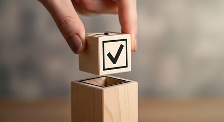 Hand placing a checkmark cube into a larger cube signifying completion and success