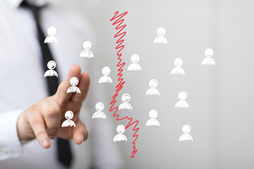 Image depicts a divided team, symbolizing conflict, separation, or loss of unity in business.