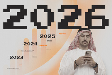 Youth in traditional attire checks phone amidst digital growth projections for 2023 to 2026