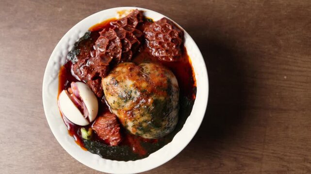 Tuo Zaafi With Green Soup, Meat, Egg, Northern Ghana staple made from corn and cassava flour, served with ayoyo jute leaf, African Dish