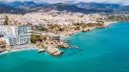Selbstklebende Fototapeten Küste Nerja, Spain - aerial view of the beautiful town on the rocky coast of the Spanish coastline  © Jair
