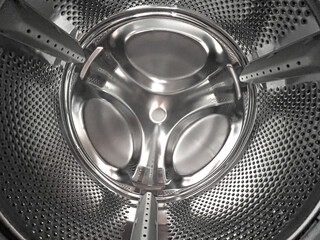 Washing machine drum interior with stainless steel texture