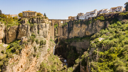 Ronda, Spain - view of its iconic bridge and the waterfall below it