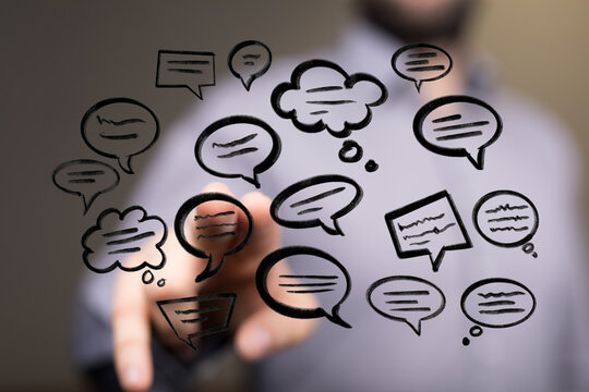 Concept of online messaging with floating speech bubble icons on a hand. Digital network, internet and social network concept. - Powered by Adobe