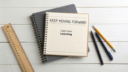 Two Notebooks Stacked with Inspirational Message for Learning Journey