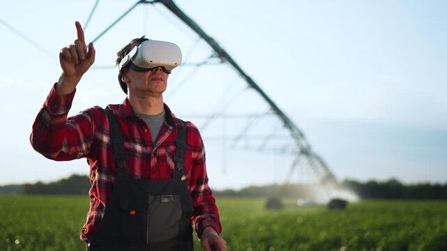 Farmer using vr headset monitors irrigation pivot in field while virtual reality technology overlays data for precision agriculture monitoring control and crop health improving irrigation efficiency - Powered by Adobe