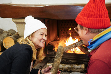 Senior Couple Enjoying Warmth by the Fire