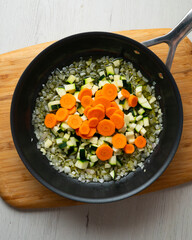 Rice paella with vegetables and salmon. Step-by-step recipe to learn how to cook.