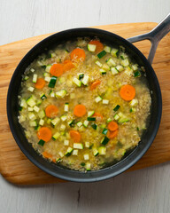 Rice paella with vegetables and salmon. Step-by-step recipe to learn how to cook.