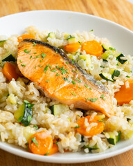 Rice paella with vegetables and salmon. Step-by-step recipe to learn how to cook.