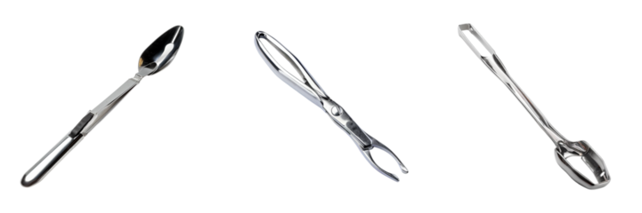 Isolated group of crab eating tools, a metal spoon crab crackers