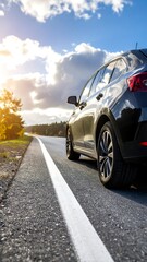 Automobile on a winding highway with bright sunshine