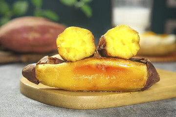 Golden Roasted Sweet Potato with Caramelized Skin on Wooden Board