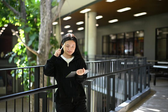 A teenage girl enjoying her creativity through digital art on a tablet - Powered by Adobe