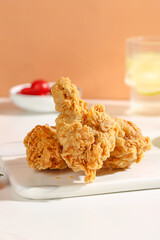 Korean Fried Chicken Thighs on White Plate Ready for Sharing