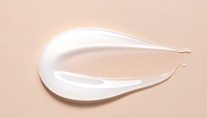 A close-up shot on a beige surface showing a smooth, pearlescent, and translucent gel sample in a curved shape. It resembles a cosmetic smear