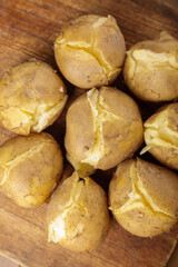 Freshly Cooked Taro Roots from Gansu China Split Open on Wooden Board Showing Creamy Interior