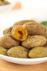 Dried Candied Fruit Without Pit on White Plate - Golden Brown Textured Snack Food