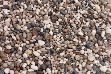 Many beautiful pebbles as background, top view