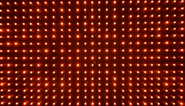 An abstract background featuring a vibrant grid of glowing orange and red LED lights creating a luminous wall.