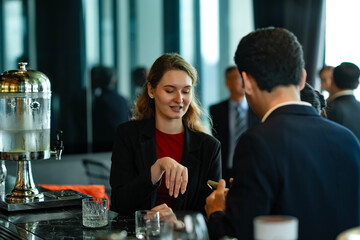 Friendly business meeting over drinks at luxury rooftop bar, showing professional connection, relaxation, and collaboration among global executives.