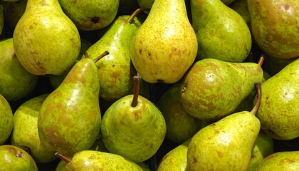 A close-up shot presents a collection of ripe, green fruits, some with brown spots, and slender stems. They appear densely packed