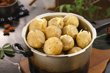 Fresh Boiled Baby Potatoes with Herbs in Rustic Cooking Pot - Healthy Comfort Food Kitchen Scene