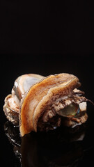 Naklejka premium Fresh Abalone Shellfish Closeup - Premium Seafood Ingredient for Gourmet Cuisine