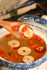 Chinese Lotus Seed Soup with Red Dates and Silver Fungus in Traditional Blue White Porcelain Bowl