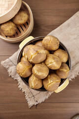 Boiled Potatoes with Butter in Rustic Kitchen Setting on Wooden Table