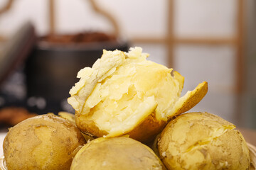 Hot Steaming Yellow Potatoes with Fluffy Interior Ready for Cooking in Kitchen