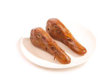 Glazed Duck Heads on White Plate - Traditional Asian Delicacy Street Food