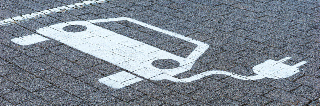 Panoramic image. Parking lot sign electric car park charging station
