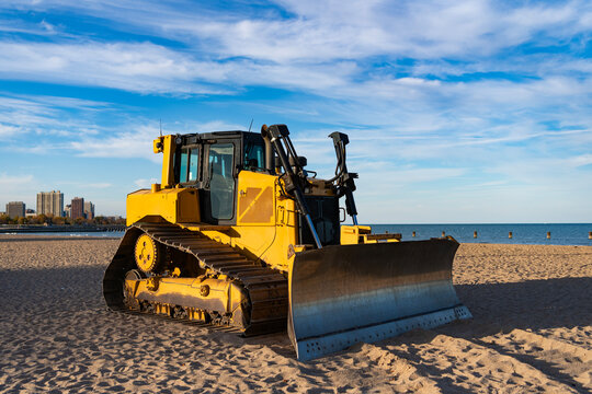 Bulldozer or dozer machinery. Old heavy equipment of bulldozer with sand in bucket. Bull dozer heavy machinery. Industrial heavy equipment. Dozer leveling ground