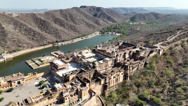 Aerial footage of Amer Fort walls winding through Aravalli hills &ndash; Jaipur, Rajasthan, India &ndash; Oct 14th, 2025