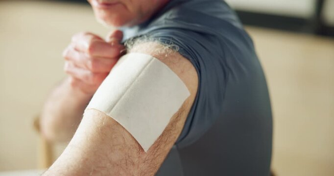 Hands, man and bandage on arm with nurse for health, healing or wellness in retirement home. Senior person, medical patch and apply transdermal medication, treatment or injury recovery with caregiver