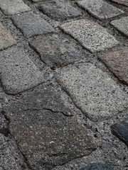 Old cobblestone pavement texture in natural light